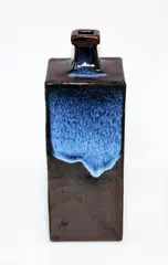 Bottle vase by Len Castle, with jun type glaze poured over tenmoku, sold Mar 2015