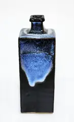 Bottle vase by Len Castle, with jun type glaze over poured tenmoku, sold Mar 2015