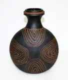 Early discoid stoneware vase by Graeme Storm, with carved decoration, sold Mar 2015