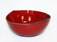 Hemispherical bowl by Len Castle, with red lava glaze, sold Mar 2015