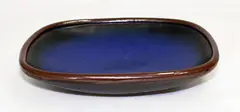 Stoneware rectangular platter by Len Castle, with blue glaze over tenmoku, sold Mar 2015