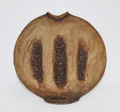 Press moulded discoid vase by Len Castle, with burnt umber pigmented surface, sold Mar 2015
