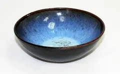 Stoneware bowl by Len Castle, with jun type glaze over tenmoku, sold Mar 2015