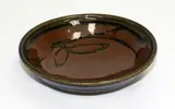 Len Castle, Stoneware bowl, with tenmoku glaze with quince blossom wax resist decoration