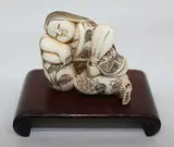 late Meiji period (1868-1912) by Japanese ivory netsuke of a sleeping bijin, sold Jul 2013