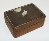Meiji period (1868-1912) by Japanese woven cane, lacquer, silver and copper lidded box, the lid decorated with an egret on a branch under the moon, sold Jul 2013