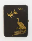 Japanese iron cigarette case, early 20th century, with gilt decoration of cranes