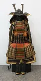 Meiji period (1868-1912) by Japanese suit of armour, including a kaputo [helmet] and face guard, sold Jul 2013
