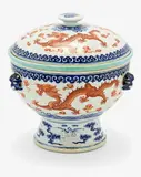 Guangxu underglaze blue six-character mark and probably of the period (1875-1908) by internal bowl and cover Chinese stemcup, painted to the exterior in iron red with dragons chasing the flaming pearl amongst clouds and flames, surrounded by ruyi, sold Jul 2013