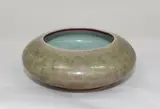 Chinese peach bloom glazed compressed globular brush washer, late Qing dynasty (1644-1911), apocryphal Kangxi six-character mark to the base
