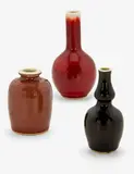 Three Chinese miniature vases, 18th century, 19th century, and 20th century, including a small mirror black double gourd vase, a small peach bloom jarlet, and a sang de boeuf bottle vase