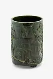 Large Chinese spinach jade brushpot, 19th century, carved with a continuous landscape scene with a sage before pavilions set amidst gardens of pine trees, ornamental rocks and waterfalls,
