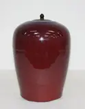 Large Chinese flambé glazed jar, 19th century, covered with a thinly crackled rich red and purple streaked glaze thinning to a cream tone to the rim