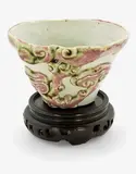 Chinese peach bloom glazed libation cup, 19th century, moulded in relief with lingzhi mushroom sprays