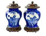 probably Kangxi period (1662-1722) by Pair of Chinese blue and white baluster vases, decorated with panels of mythical beasts, each vase with wood cover and wood stand, sold Jul 2013
