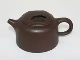 attributed to Pei Shimin (1892-1976) by Chinese Yixing teapot and cover, moulded with a c-shaped handle and short spout, offered Jul 2013