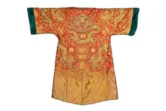 Anna Pavlova Chinese red silk Mandarin coat, early 19th century, richly embroidered in gold thread with dragons amidst clouds above scrolling waves, re-cut and fitted with dark velvet lining