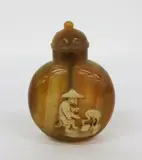 Chinese agate carved snuff bottle, 18th/19th century, depicting a man and a crane in ivory white relief