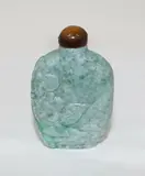 Chinese jadeite snuff bottle, 19th century, carved with a cricket and prunus flowers on one side