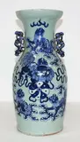 Chinese baluster vase, 19th/20th century, decorated in celadon and underglaze blue with Buddhist lions playing with a brocade ball amongst clouds