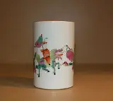 early 20th Century by A Chinese famille rose brushpot, painted with an Immortal riding a Buddhist lion with two young servants, offered Feb 2012