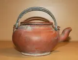19th/20th Century by A Chinese Yixing teapot and cover, H. 110, offered Feb 2012
