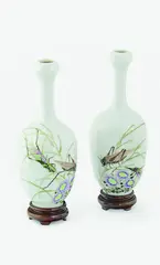 A matched pair of Chinese famille rose bottle vase, early 20th Century, similarly painted with two crickets amongst flower and foliage, calligraphy lines to the reverse, artist sealmark to the base, wood stands