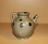 A small iron spotted ewer, and a Yue-style celadon dish