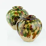 Tang Dynasty (618-907) by A matched pair of small Chinese sancai jars, the buff body covered with a splashed amber, green and colorless glaze layer, offered Feb 2012