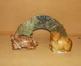 Three Chinese archaistic jade carvings, comprising a huang, a Budhist lion and a horse