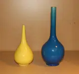 first quarter of the 20th Century by A Japanese turquoise glazed bottle vase, together with a smaller English monochrome yellow crackled glazed bottle vase, sold Feb 2012