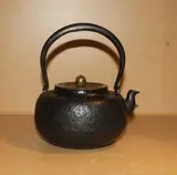 Meiji period by A Japanese Tetsubin teapot, with cast iron body and brass lid, sold Feb 2012