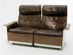 A modular system designed in 1962 by Dieter Rams, which can be converted with the following lot to make a three seater sofa, sold Sep 2011