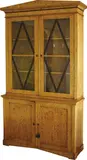 A Biedermeier bookcase chiffonier, In Karelian birch with ebony glazing bars forming diamond pattens which echo the escutcheons