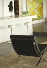 Eileen Gray for ClassicCon, Bar Stool No.1, pair of height adjustable bar stools, placed under white bench on the left