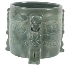 Olive Jones, Cylindrical vase with Maori figural supports, Pottery with incised koru motifs and pale green glaze