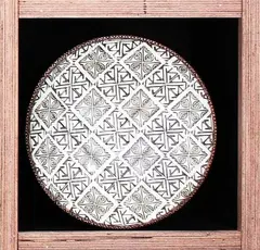 Steven Scholefield, White surfaced high fired earthenware dish impressed with a pattern of Theo Schoon's stamps., Impressed pottery mark, artists cipher and dated 2003.