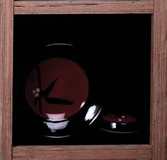 Shallow bowl and circular lidded box by Peter Collis, Black and plum glazed with brushwork blossom decoration, sold Oct 2007