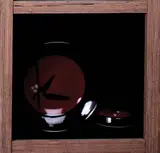 Peter Collis, Shallow bowl and circular lidded box, Black and plum glazed with brushwork blossom decoration