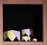 Jean van der Putten, Set of four graduated cubes painted with geometric panels, Largest 125mm2, smallest 35mm2