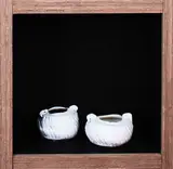 Peter Lange, Two porcelain squat circular vessels with wrythen fluted walls