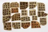 Len Castle and Theo Schoon, 19 earthenware tablets, 19 umber pigmented earthenware tablets made by Castle, impressed with Schoon's stamps