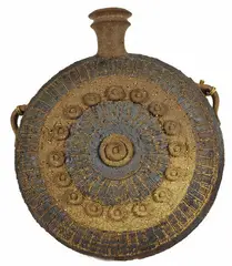 earthenware discoid wall vase by Peter Stichbury, impressed with artist's cipher, circa 1970s, sold May 2007