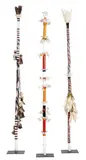 Three Morning Star Poles by Gali Yalkarriwuy & Richard Dhaymutha, 2007-08, ochre/acrylic on wood with feathers and string, sold May 2023