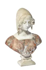 A White And Coloured Marble Bust 'Puritas' By Professor Aristide Petrilli, Carved as a maiden wearing a coif with lilies in her hair, her incised bodice centred with a lily and inscribed 'Puritas', on square socle, incised to verso 'Gal' Prof A Petrilli Firenze'., sculpture