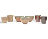 Gwyn Hanssen-Pigott, Two Beakers (Bronze), Cup (Cream), Jug and Three Bowls (Blue and Cream) c1990