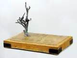 John Kelly, Cow up a Tree 2000, 2000, painted bronze on wooden butcher's chopping block