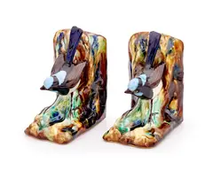 Grace Seccombe, Pair of Blue Wren bookends, circa 1945, 1945, glazed earthenware, each realistically modelled as a bird perched on a naturalistic ground