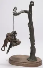 George Walbye, Suspended Saddle, Bronze with dark brown patina on walnut base