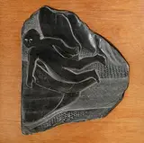 Barbara Warren, Icarus, slate carving on wood